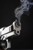 smoking-handgun-against-black-background_1890315.jpg