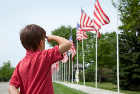 boy-saluting-flags-veterans.jpg