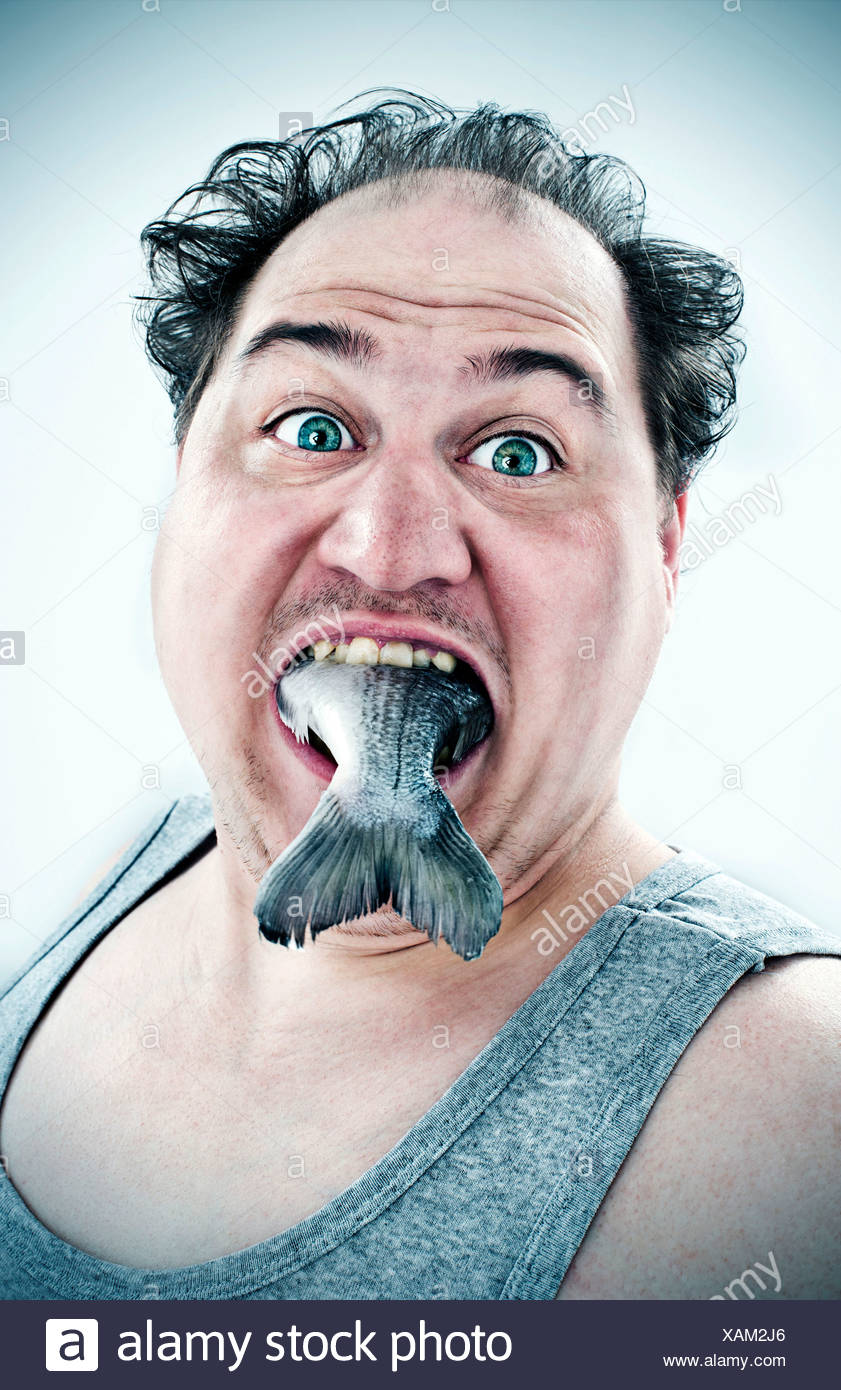 chubby-man-with-a-fish-in-his-mouth-XAM2J6.jpg