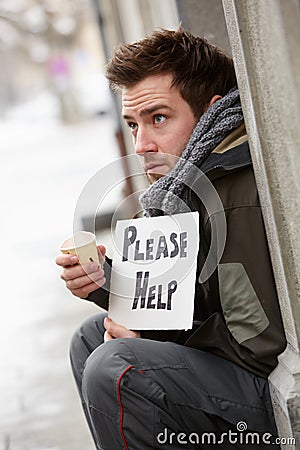 homeless-young-man-begging-street-24386122.jpg