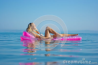 blonde-girl-on-inflatable-raft-thumb10306728.jpg