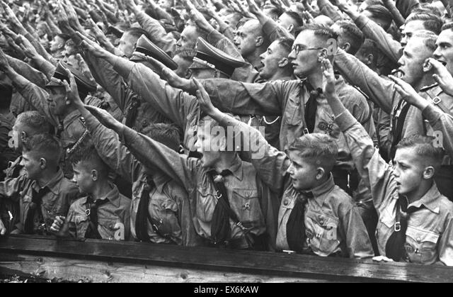 nazi-rally-with-hitler-youth-members-in-foreground-1936-ex6kaw.jpg