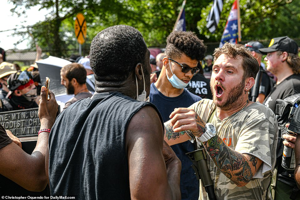 31988796-8631027-Heavy_armed_militia_marched_towards_Stone_Mountain_Park_today_St-a-37_1597518150193.jpg